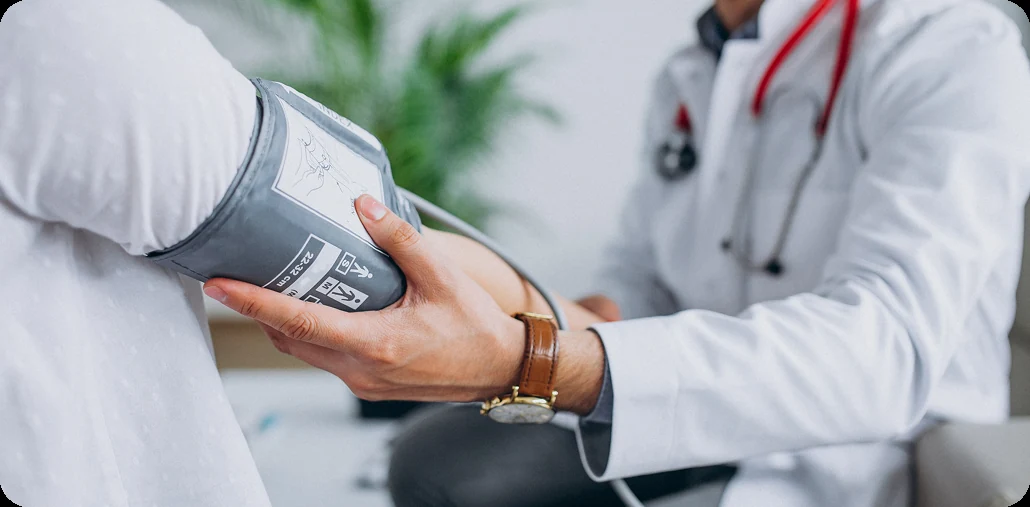 Clinician measuring a patient's blood pressure